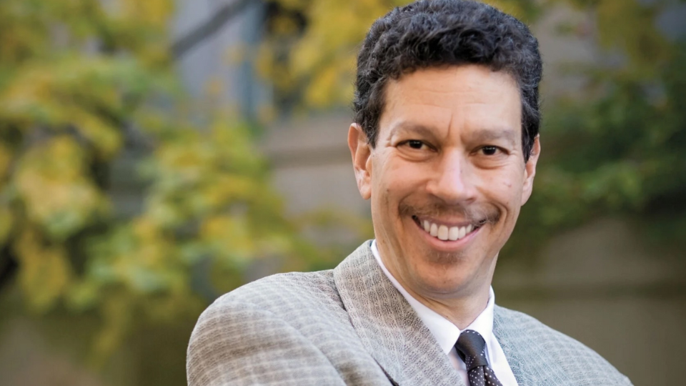 Professor David Wilkins smiles at the viewer