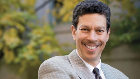 Professor David Wilkins smiles at the viewer