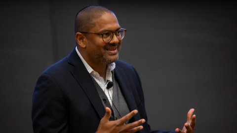 Desmond Jagmohan jesticulates while making a point during a lecture.