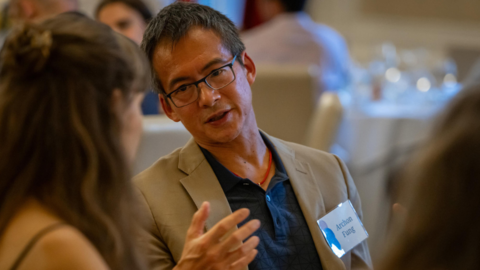 Archon Fung speaks with a fellow guest