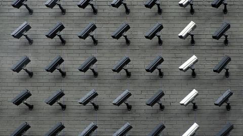 wall of surveillance cameras