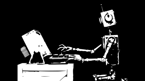 Robot typing on a computer