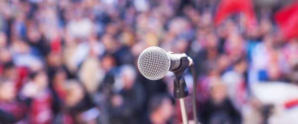 microphone in front of a blurred crowd